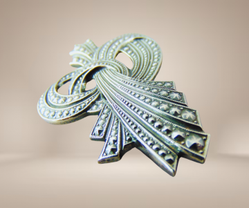 Art nouveau stijl  broches zilver strik knoop puntjes beige achtergrond 3