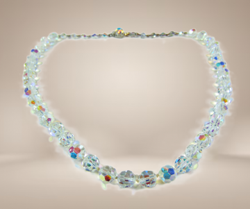 Enkele streng aurora borealis ronde kralen bakslot enkele ab sluiting beige achtergrond 2