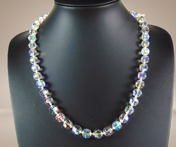 Enkele streng aurora borealis ronde kralen bakslot enkele ab sluiting beige achtergrond 3