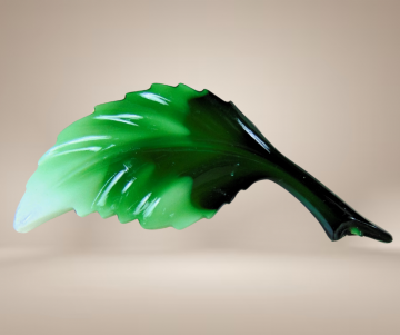 Groen plastic blad broche beige achtergrond