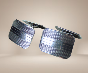 Herman murle zilveren manchetknopen beige achtergrond 1