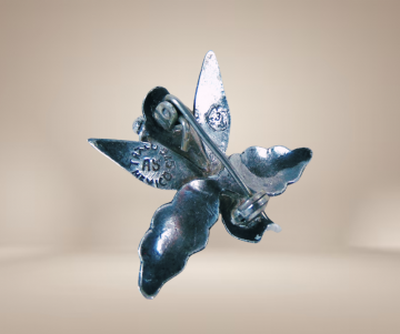 Mexico taxco zilveren iris broche toggle beige achtergrond